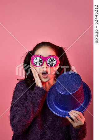 Surprised asian woman, Shouting girl wearing funny glasses on isolated pink background. Surprised asian woman, Shouting girl wearing funny glasses on isolated pink background. 62446212