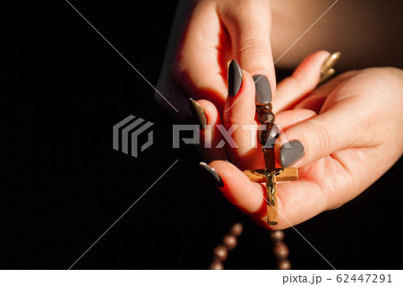 Female hands with crucifix cross close-up. Female hands with crucifix cross close-up. 62447291