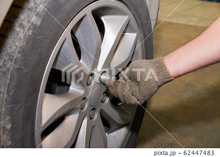 The process of changing tires on a car before the The process of changing tires on a car before the 62447483