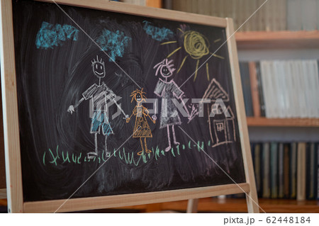Children multicolored chalk drawing on blackboard 62448184