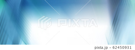 Wide abstract banner, business modern city urban futuristic architecture panoramic background, motion blur, reflection in glass of high rise skyscraper facade, toned blue picture with bokeh. 62450931