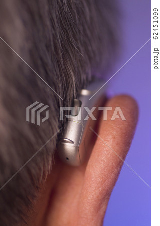Man with hearing aid Man with hearing aid 62451099