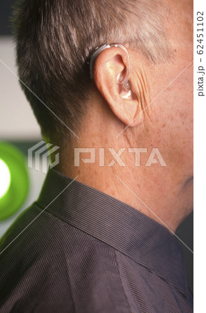 Man with hearing aid Man with hearing aid 62451102