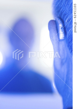 Man with hearing aid Man with hearing aid 62451103