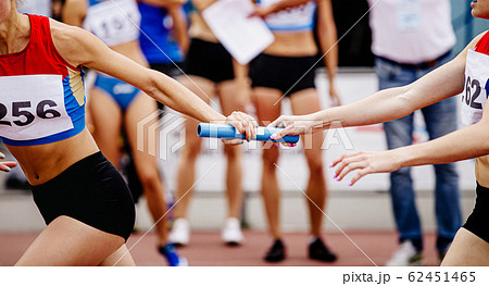 women relay team passing of baton 62451465
