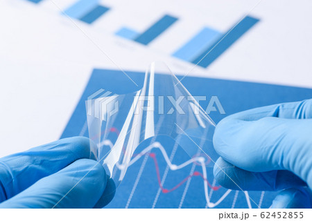 Scientist show novel transparent flexible film material in laboratory 62452855
