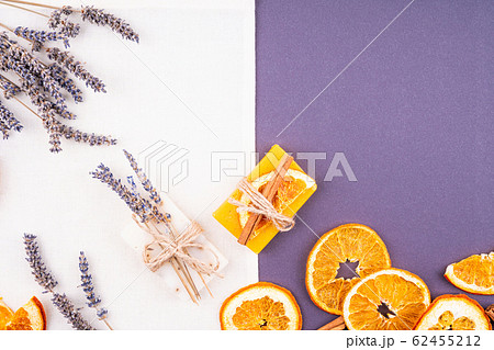 Two pieces of soap, lavender and oranges.  62455212