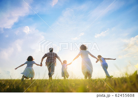 Happy family on summer walk 62455608