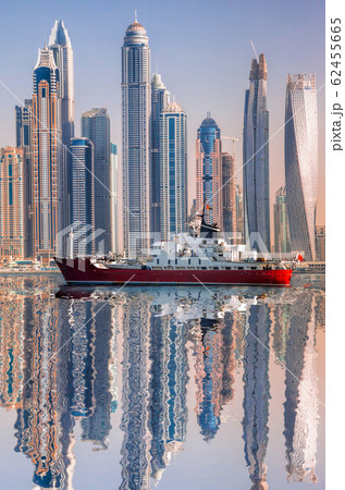 Panorama of Dubai with ship against skyscrapers in UAE Panorama of Dubai with ship against skyscrapers in UAE 62455665