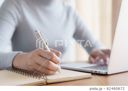 Hand of business women using laptop and write 62460672