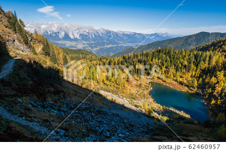 Calm autumn Alps mountain lake with clear Calm autumn Alps mountain lake with clear 62460957