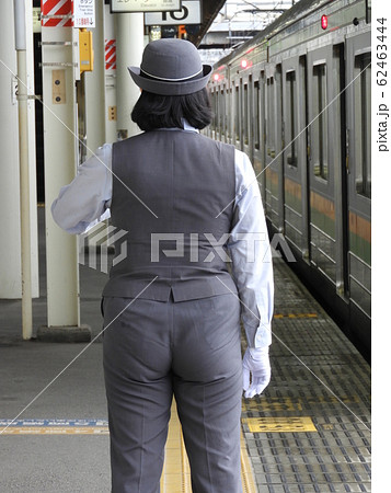 Back View Of A Female Conductor Who Is Checking Stock Photo