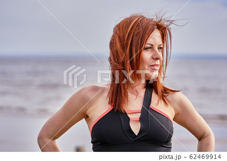 Portrait of a middle-aged woman with red hair Portrait of a middle-aged woman with red hair 62469914