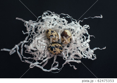 Quail eggs on black background. Easter backdrop.  62475353