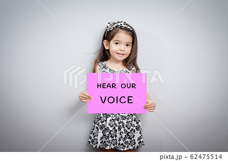little girl with sign hear our voice 62475514