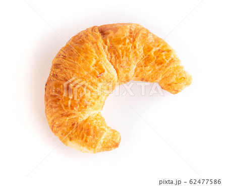 Closeup top view fresh croissant isolated on white Closeup top view fresh croissant isolated on white 62477586