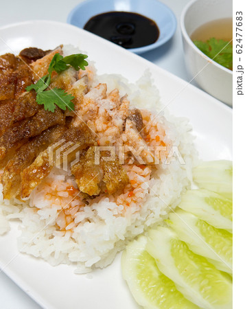 BBQ Pork and Crispy Pork with Rice. Closeup Useful as background for design-works. closeup (Thai food) BBQ Pork and Crispy Pork with Rice. Closeup Useful as background for design-works. closeup (Thai food) 62477683