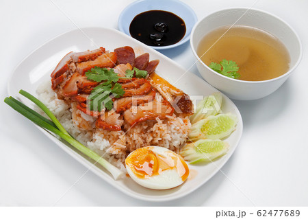 Barbecued red pork in sauce with rice, Chinese style roasted pork. 62477689