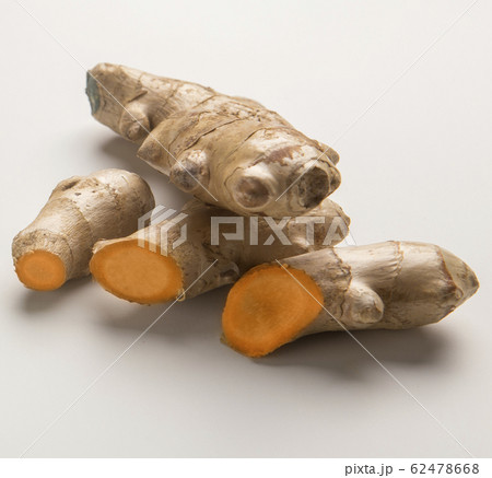 Cutting or sliced turmeric curcuma root on white Cutting or sliced turmeric curcuma root on white 62478668
