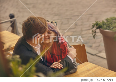 couple in love outdoor.Stunning sensual outdoor portrait of young stylish fashion couple posing in spring in city 62481594