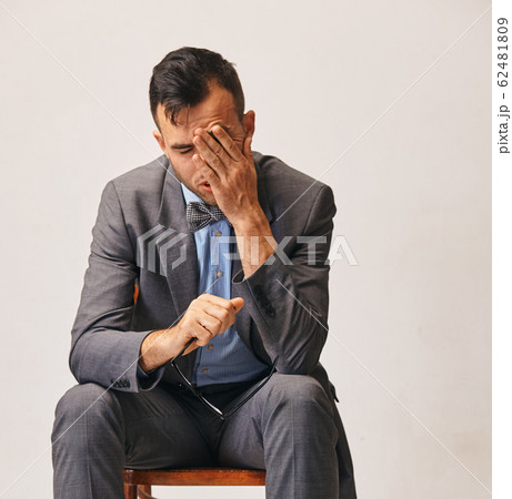 a portrait of young stylish businessman He is very tired from work 62481809