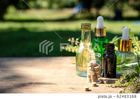 Essential oil of Basil and herbal medicine have a natural background. Essential oil of Basil and herbal medicine have a natural background. 62483168