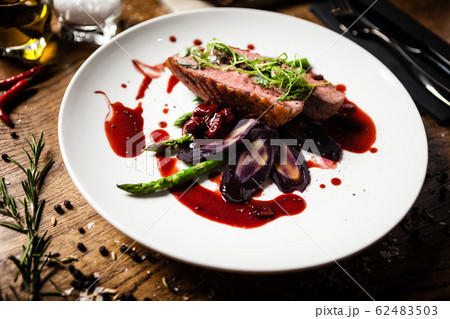 Duck breast served on a plate in restaurant 62483503