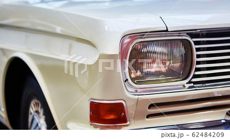 Detail of classic car. Close-up of headlight of the museum of vintage cars Detail of classic car. Close-up of headlight of the museum of vintage cars 62484209
