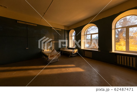 Hospital ward with large semicircular windows and 62487471