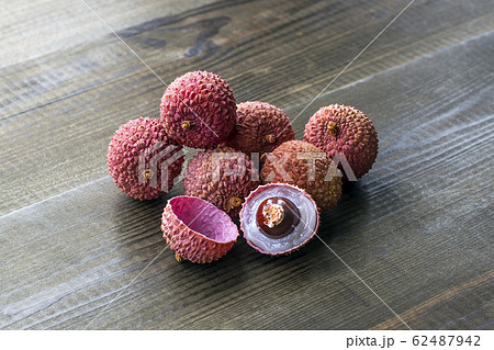 lychee fruits on wooden background 62487942