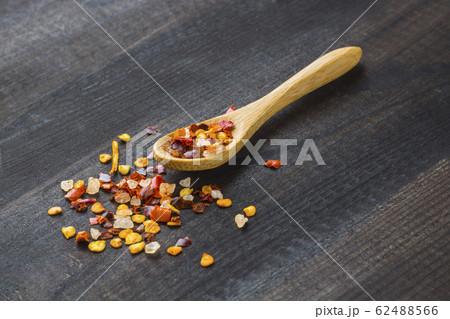 chilli powder on wooden spoon 62488566