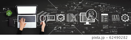 Document management system concept with person using laptop computer 62490282