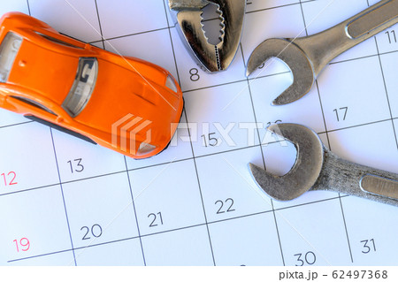 wrench and car on the calendar with numbers. 62497368