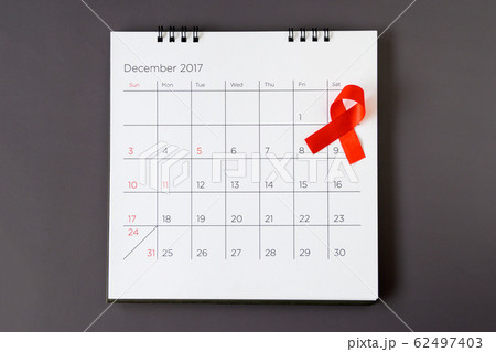 World AIDS day concept, red ribbon the date 1 World AIDS day concept, red ribbon the date 1 62497403