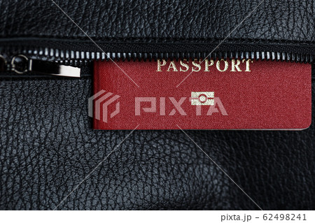 Passport looks out of the pocket of a black 62498241