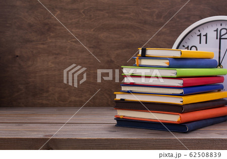 notepad or paper notebook at wooden table 62508839