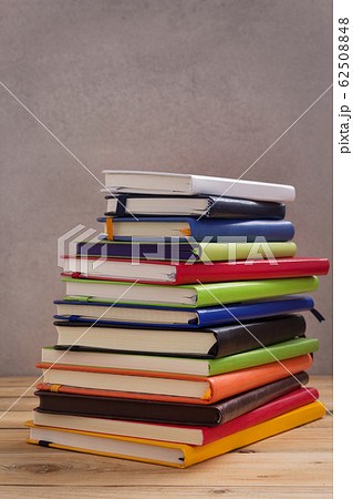 notepad or paper notebook at wooden table notepad or paper notebook at wooden table 62508848