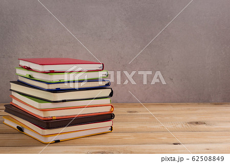 notepad or paper notebook at wooden table 62508849