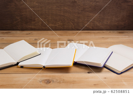 notepad or paper notebook at wooden table notepad or paper notebook at wooden table 62508851