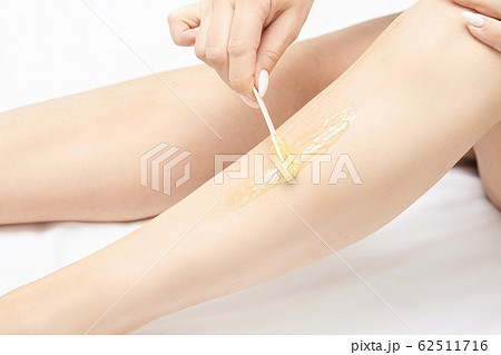 Hair removal at spa luxury studio. Woman legs wax 62511716