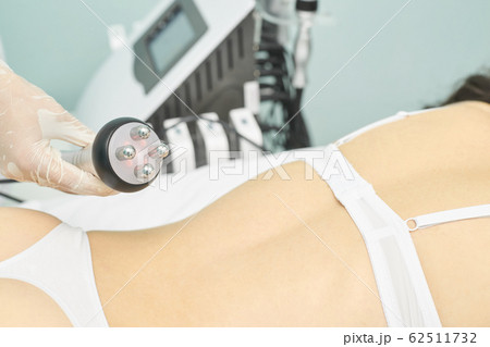 Perfect radio treatment. Woman at spa procedure. 62511732
