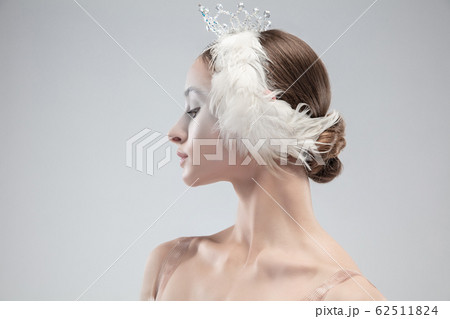 Close up of young graceful ballerina on white studio background 62511824