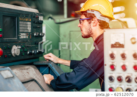 young profession technician engineer operate heavy machine to automated CNC young profession technician engineer operate heavy machine to automated CNC 62512070