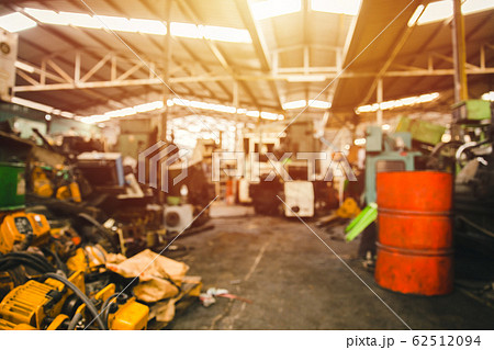 Blur used machinery workshop garage or heavy machine junkyard warehouse 62512094
