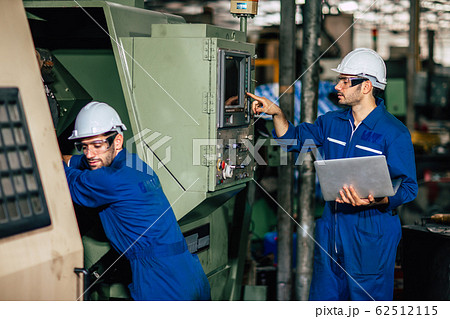 Machine service team checking CNC and re-programming g-code process 62512115