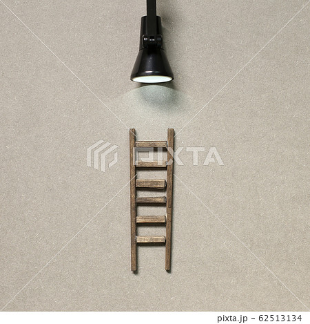 Wooden ladder with lamp light. Development, challenge, success concept 62513134