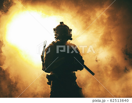 Soldier silhouette on background of fire and smoke 62513640