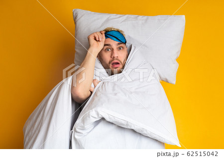 Funny guy woke up on yellow background Funny guy woke up on yellow background 62515042