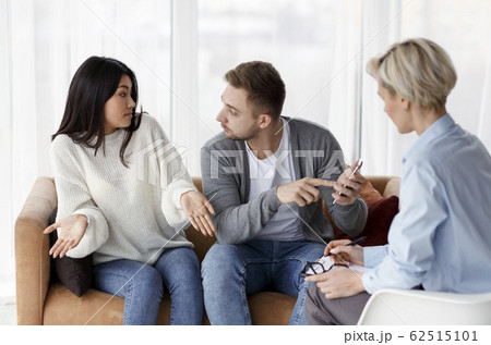 Husband Blaming Cheating Wife During Couples Therapy Session Indoor Husband Blaming Cheating Wife During Couples Therapy Session Indoor 62515101