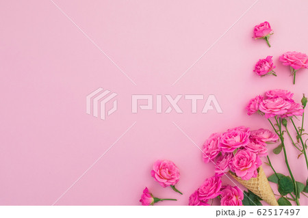 Floral frame of pink roses flowers isolated on pink background. Flat lay, Top view Floral frame of pink roses flowers isolated on pink background. Flat lay, Top view 62517497